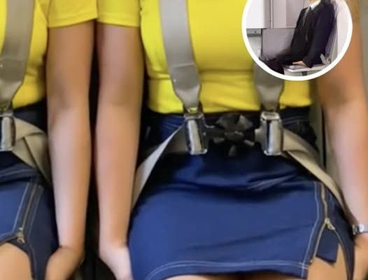 The Surprising Reason Flight Attendants Sit with Their Hands Tucked During Takeoff and Landing